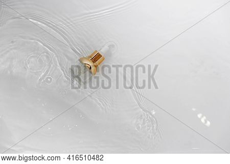 Transparent Golden Bottle With Pipette And Hylauronic Acid. Top Horizontal View Copyspace