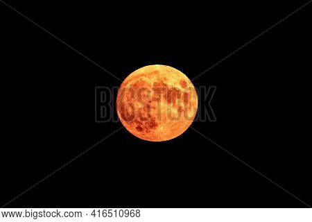 Bright Orange And Red Fool Moon Over The Sea. Red Full Moon In Red Color Also Called Bloodmoon