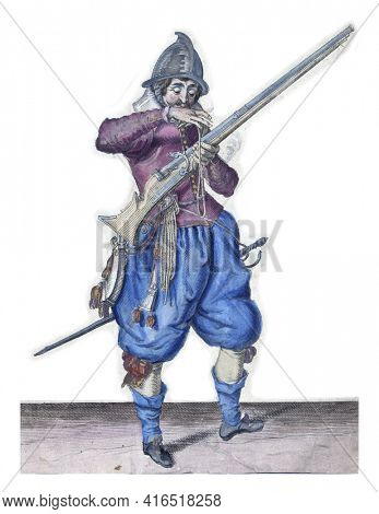 A soldier, full-length, to the right, holding a rudder (a particular type of firearm) with his left thigh and pulling his ramrod out of the barrel with his right hand, vintage engraving.