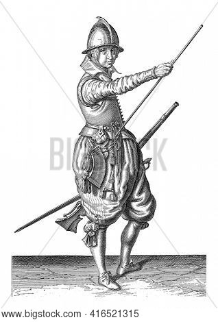 Soldier with a rudder sliding his right hand to the end of his ramrod, vintage engraving.