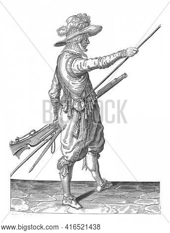 A soldier, ten feet, to the right, holding a musket (a particular type of firearm) with his left thigh with his left thigh and bringing his right hand to the end, vintage engraving.