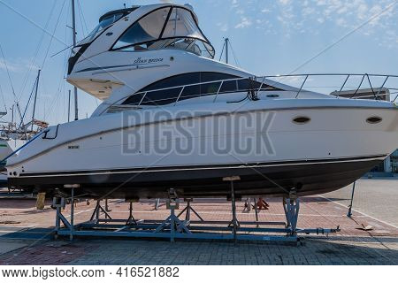 Pyeongtaek, South Korea; April 6, 2021: Sea Ray Yacht With Sedan Bridge On Metal Storage Rack At Jeo