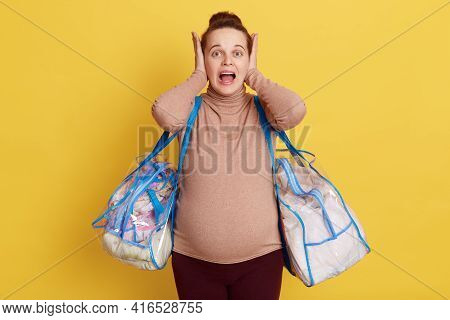 Frustrated Pregnant Woman Screaming With Crazy Expression Feels Panic, Cover Ears And Widely Opens M