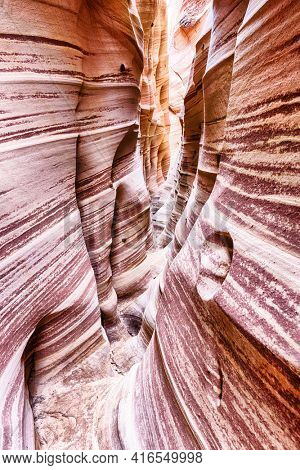 Zebra Canyon is a vivid striped and very narrow gorge. The awsome zig-zag shapes were created by water. Grand Staircase-Escalante National Monument, Utah. USA