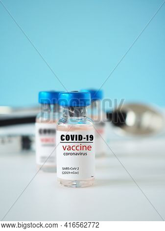 Close-up Of A Simulated Covid-19 Vaccine In A Vial For Protective Coronavirus On White Background Wi