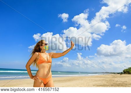 Funny Girl Taking Selfie Photo By Smartphone On Tropical Sea Beach. New Rules To Wear Cloth Face Cov