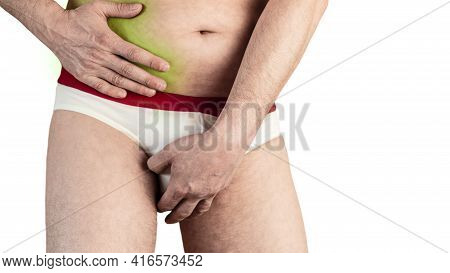 A Man In Shorts Holding On To His Sore Side. Sick Liver. Sharp Pain In The Side. Isolated White Back