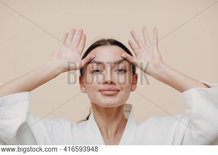 Young Woman Doing Face Building Facial Gymnastics Self Massage And Rejuvenating Exercises