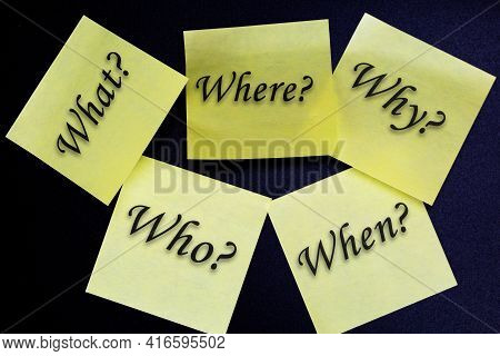 Who, Why, What, When And Where Written On Yellow Sticky Notes On Black Background . The Five Ws. Bus