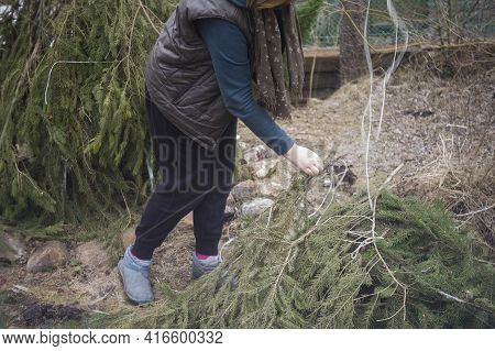Blurred Motion Shot Of A Woman Unwrapping Her Schrubs In A Windy Day