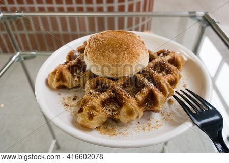 A Baked Croissant Dough In Waffle Iron With A Scoop Of Vanilla Ice Cream.