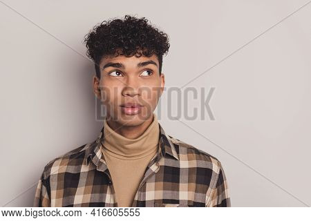 Photo Of African Guy Curious Look Empty Space Think Wear Checkered Shirt Rollneck Isolated Grey Colo