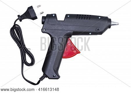 Glue Gun With Electric Cord On White Isolated, Black Object, Close-up.