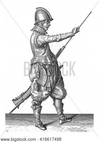 A soldier, full-length, to the right, holding a rudder (a particular type of firearm) with his left thigh and pulling his ramrod out of the barrel with his right hand, vintage engraving.