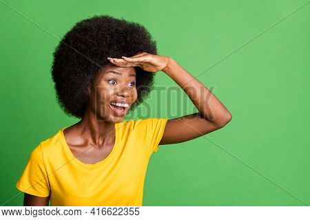 Photo Of Young Happy Excited Crazy Afo Woman Looking Forward Ahead In Copyspace Isolated On Green Co