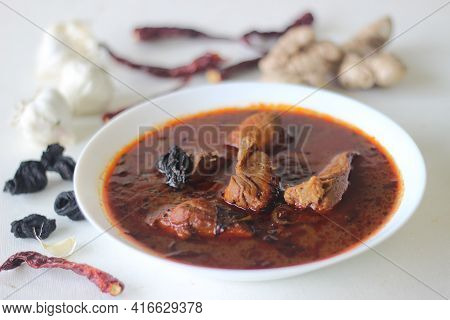 Fish Curry With Red Gravy Prepared In Traditional Kerala Style. Fish Used Is Bluefin Trevally, Local