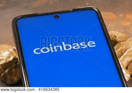 Coinbase Crypto Exchange Logo On Screen With Gold. Ljubljana, Slovenia - April 12 2021