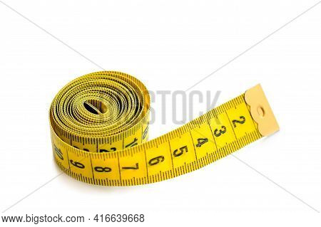 Yellow Isolated Metric Measuring Tape Isolated On White Background. Centimeter, Close-up