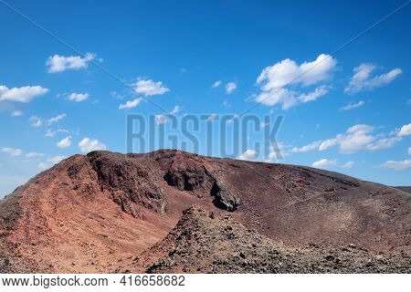 Mount Etna In Sicily Near Catania, Tallest Active Europe Volcano In Italy. Red And Purple Lava Field