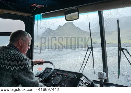 Thorsmork,iceland-06.05.2019: Driver Of An Off-road Bus Pays Close Attention When Crossing River In 
