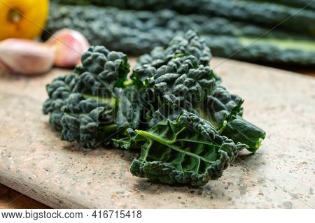 Cooking With Black Flat Leaves Of Cavolo Nero Tuscan Cabbage