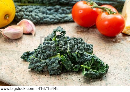 Cooking With Black Flat Leaves Of Cavolo Nero Tuscan Cabbage
