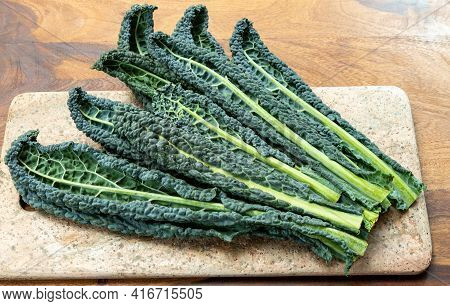 Cooking With Black Flat Leaves Of Cavolo Nero Tuscan Cabbage