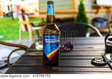 Romanian Timisoreana Beer Isolated, Close Up Of Glass Beer Bottle. Alba Iulia, Romania, 2021