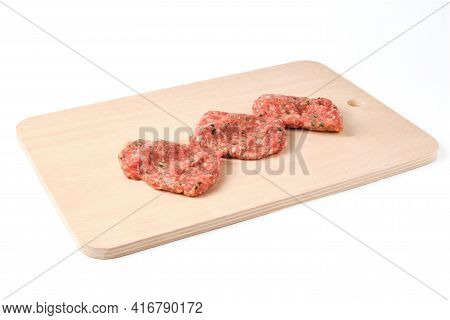 Homemade Traditional Turkish Cutlets Kofte Lay On A Cutting Board Isolated On White. Cutlets Made Of