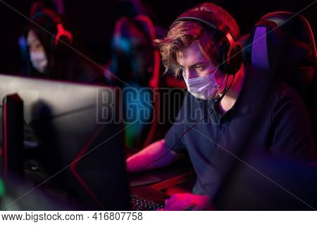 Portrait In A Medical Mask During The International Esports Games Tournament. A Computer Geek With H