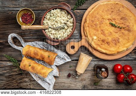 Crepes Or Pancakes Stuffed With Chicken Meat On The Wooden Table. Banner, Menu Recipe Place For Text