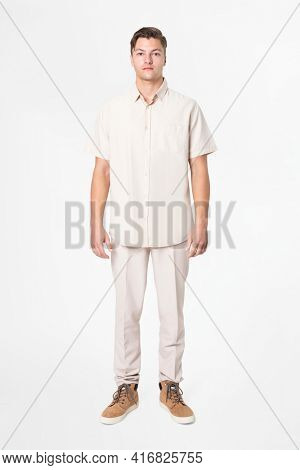 Man in beige shirt and pants casual wear fashion full body