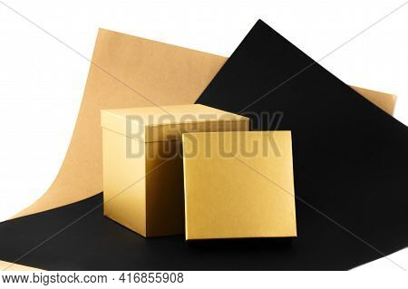 Set Of Two Minimal Gift Boxes, Big Open Golden Shining Box On A Background Of Beige, Black, White Pa