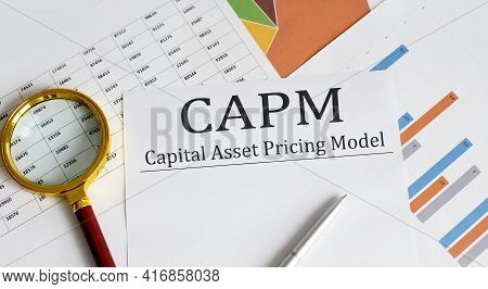 Paper With Capm Capital Asset Pricing Model On A Table, Business