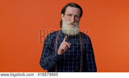 Hey You, Be Careful. Elderly Old Man In Warning With Admonishing Finger Gesture, Saying No, Be Caref