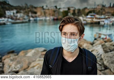 Deserted Turkish Resort Of Antalya With A Lone European Tourist Wearing Protective Face Mask.