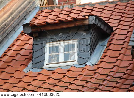 A Dormer Window Edged With Slate Panels.