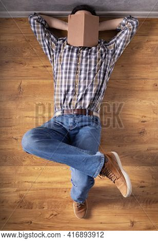 Man relaxing on floor thinking idea solitions. Man student lying studying and book on face. Creative inspiration study concept