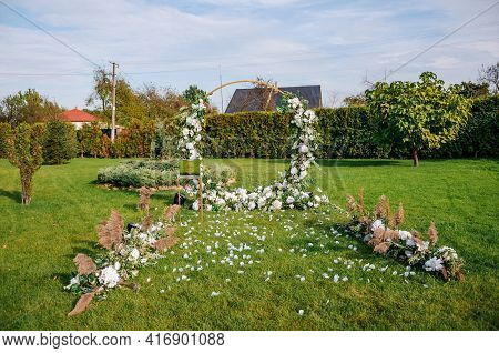 Wedding Arch With Multi-colored Flowers. Wedding Decorations
