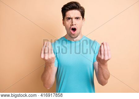 Portrait Of Mad Annoyed Guy Claiming Pretense Having Fight Isolated Over Beige Pastel Color Backgrou