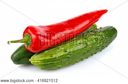 Two Ripe Green Cucumbers With Red Hot Chili Pepper In Stack Isolated On White Background
