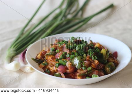 Air Fried Cottage Cheese Cubes And Baby Corn Prepared With Chilli Sauce. It Is An Indo Chinese Dish,
