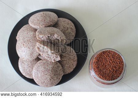 Steamed Cakes Made With Finger Millets And Skinned Black Gram. Locally Known As Ragi Idli.