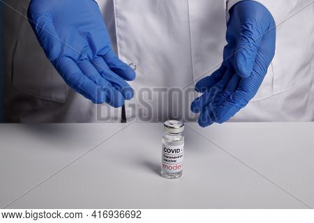 Krasnoyarsk, Russia. April 7, 2021. Doctor Shows Moderna Covid Vaccine Phial. Drugstore Man Offers I