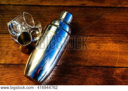 Bar Ustensils, Drink Concept. Cocktail Shaker Accessories On A Wooden Board.