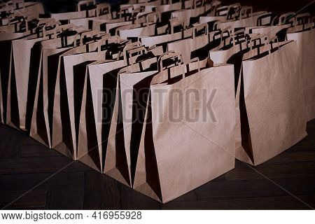 Craft Paper Bags. The Concept Of Delivering Goods Or Food From Stores. Space For A Logo Or Design. E