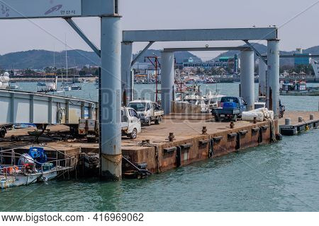 Pyeongtaek, South Korea; April 6, 2021: Trucks Parked On Ocean Vessel Loading Dock At Jeongok Port.