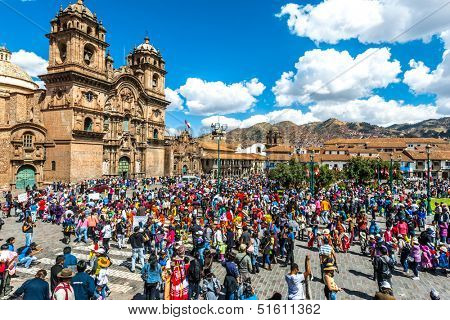 Cuzco, Peru - July 12, 2013: people at festival  in the Plaza de Armas at Cuzco Peru on july 12th, 2013. This plaza has been the scene of the proclamation by Francisco Pizarro in the conquest of Cuzco