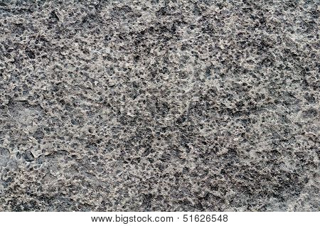 Heavily Pitted Stone Surface