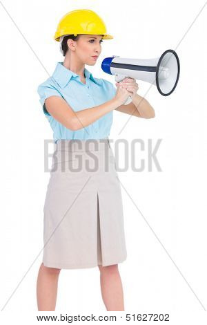 Stern attractive architect on white background holding megaphone